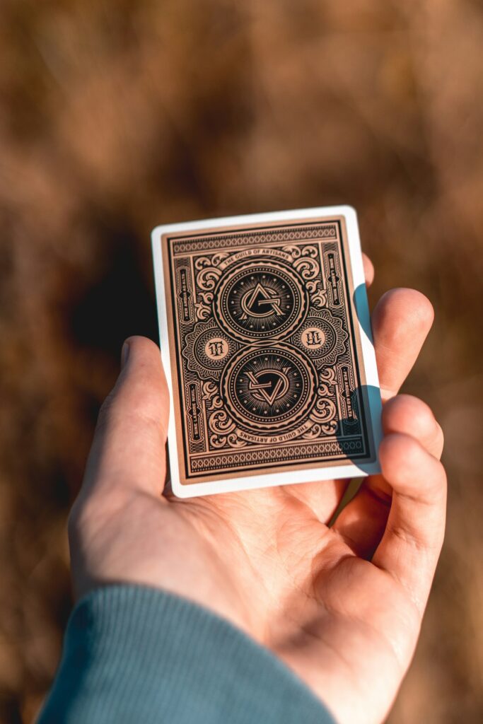 Person holding an Oracle Deck.