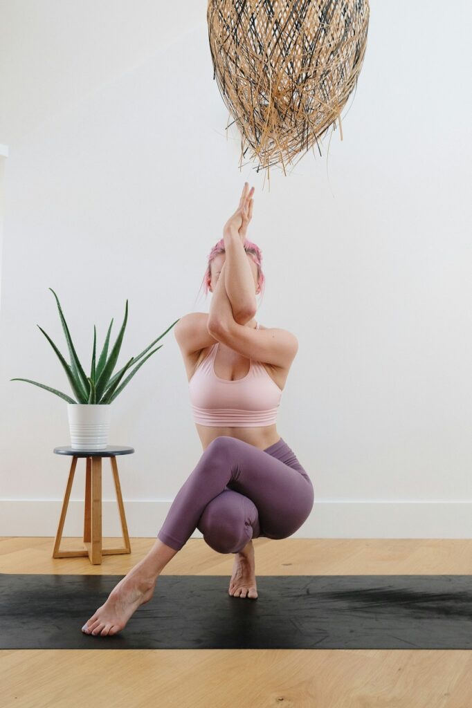Woman holding a yoga pose.