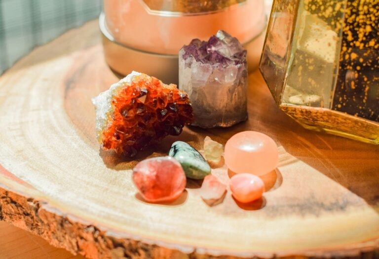 Various crystals on a wooden table.