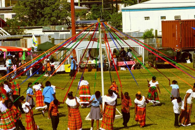 People dancing around a maypole.