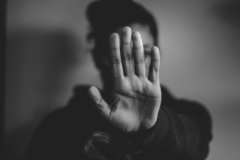 Woman palm towards you.