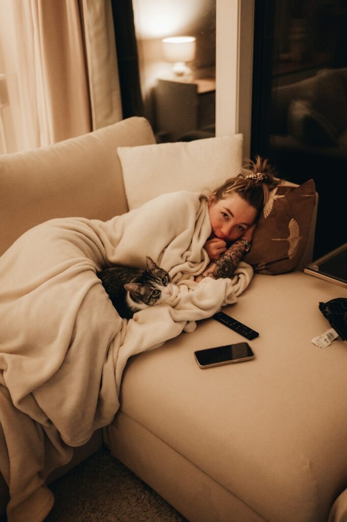 Woman under blanket.