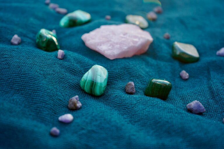Crystals laid on green blanket.